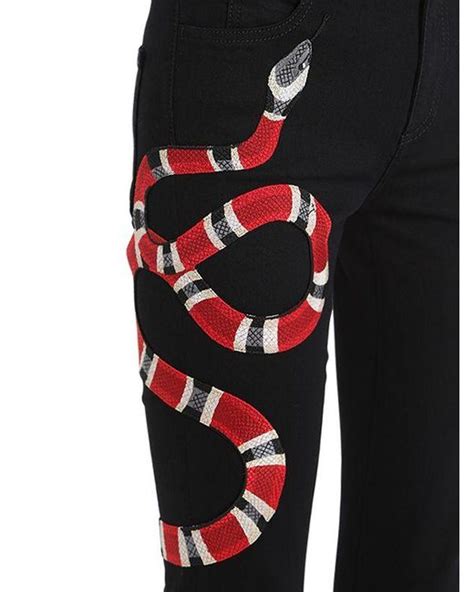 snake pants gucci|gucci snake embroidered jeans.